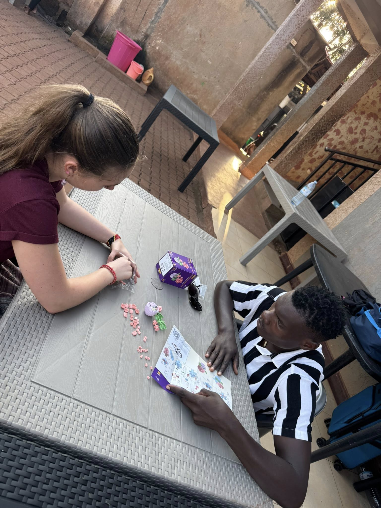 Claire spending time with an orphan at UOCC